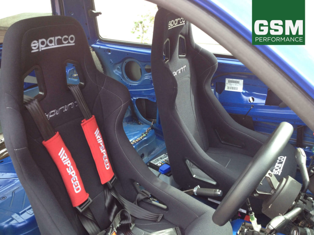 Sparco Sprint seats with black harness belts 1