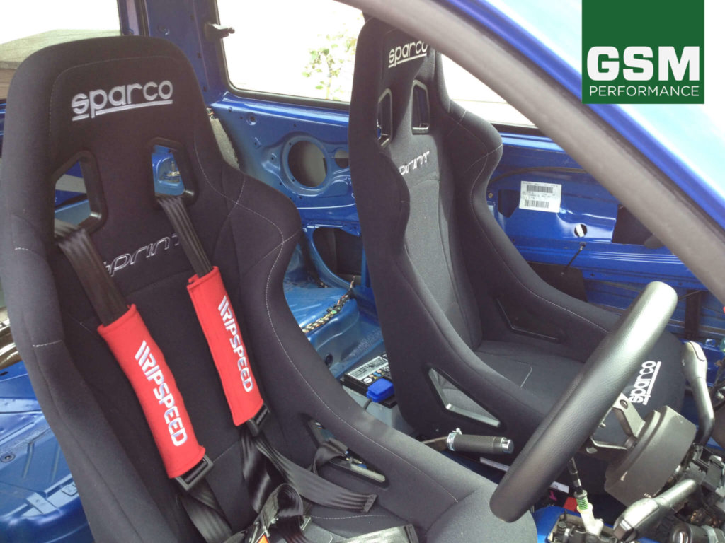 Sparco Sprint seats with black harness belts 1